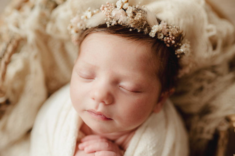 Newborn Photography, baby asleep with floral crown on head